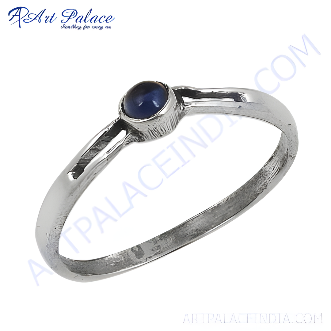 Sterling silver ring with a vibrant blue gemstone, perfect for everyday wear.