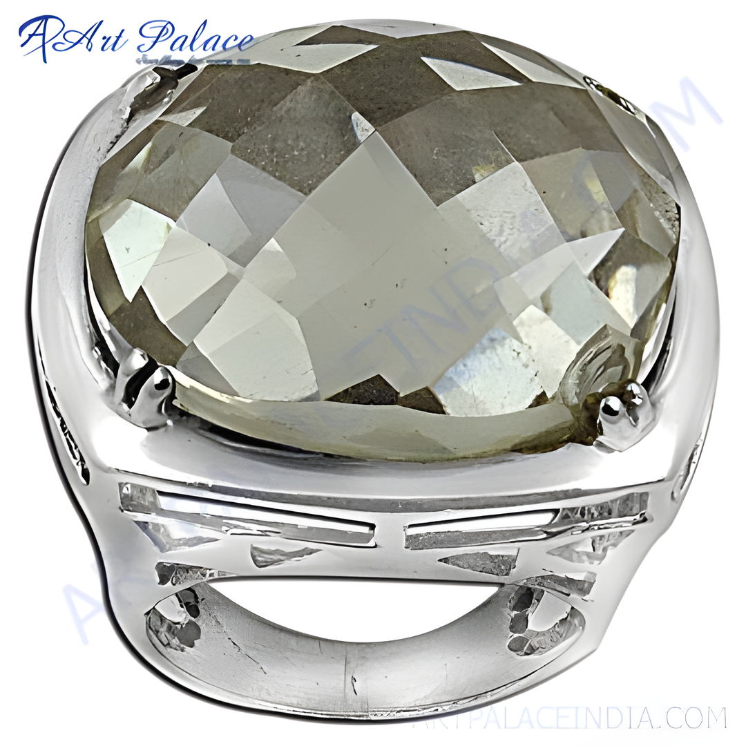 Silver ring with a large, faceted, clear gemstone set in a polished silver band