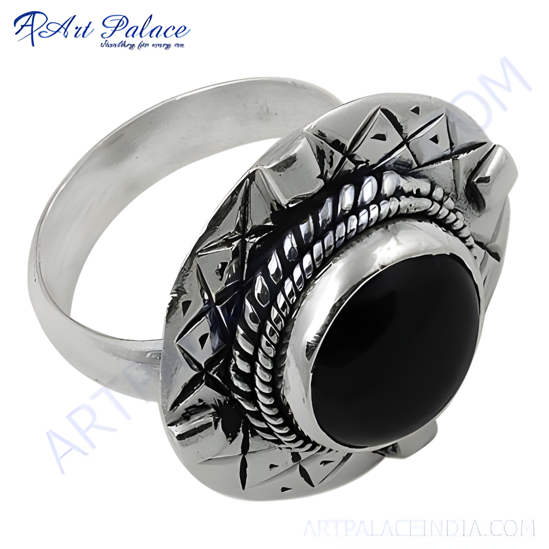 Sterling silver ring with a large, oval-shaped black onyx gemstone set in an ornate design.