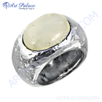 Load image into Gallery viewer, Sterling silver statement ring with a large, oval, cream-colored cabochon gemstone
