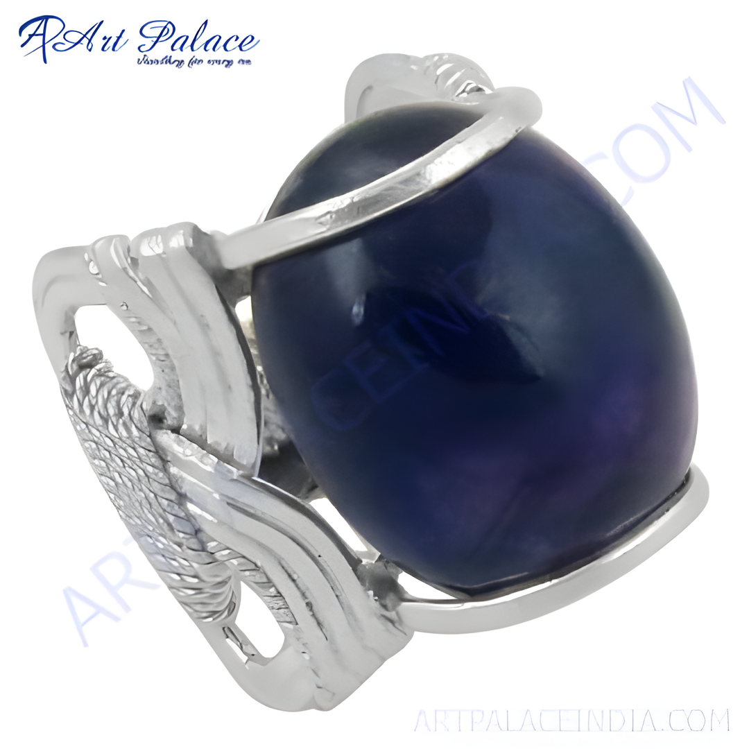 Sterling silver ring with a large oval-shaped blue gemstone, a statement piece for women.