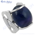 Load image into Gallery viewer, Sterling silver ring with a large oval-shaped blue gemstone, a statement piece for women.
