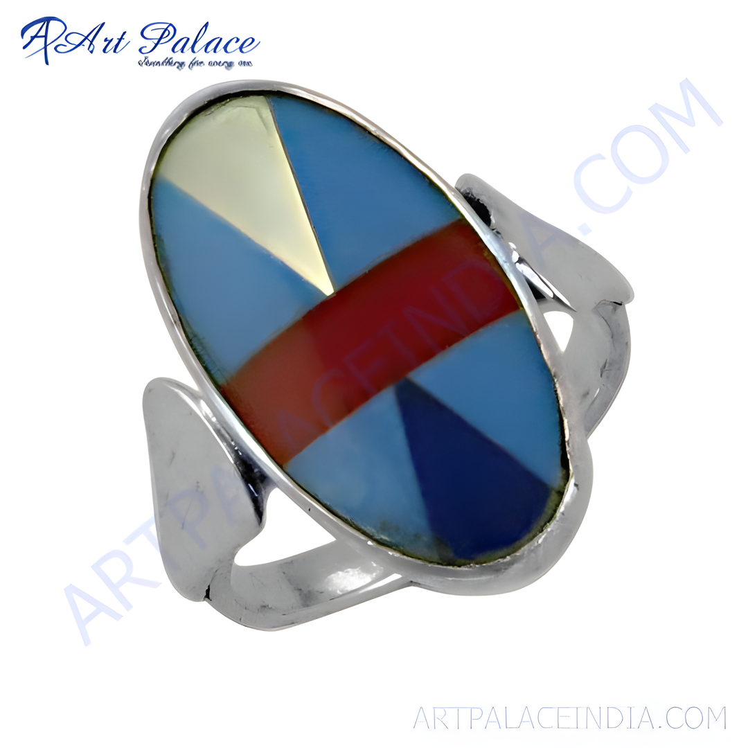 Silver geometric stone ring with blue, red, and yellow inlaid gemstones.
