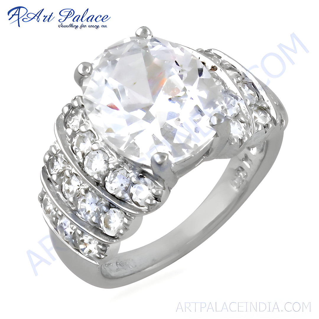 Sterling silver ring with a large, round cubic zirconia center stone and smaller stones on the band.
