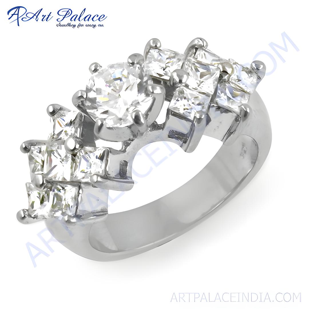 Silver ring with round and princess-cut cubic zirconia stones on a white background.