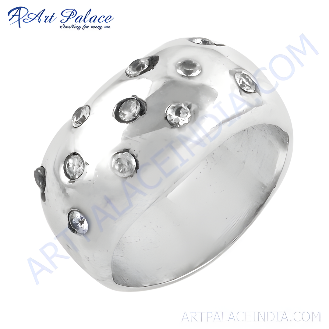 A round silver ring with multiple clear cubic zirconia stones embedded in the surface, perfect for women.