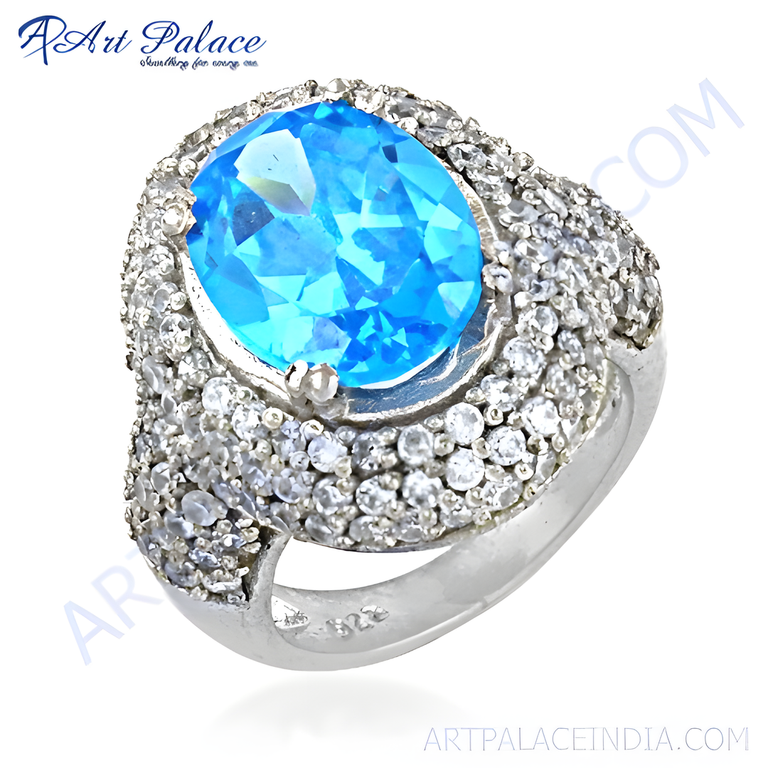 925 sterling silver ring with a large blue topaz gemstone and sparkling cubic zirconia accents.