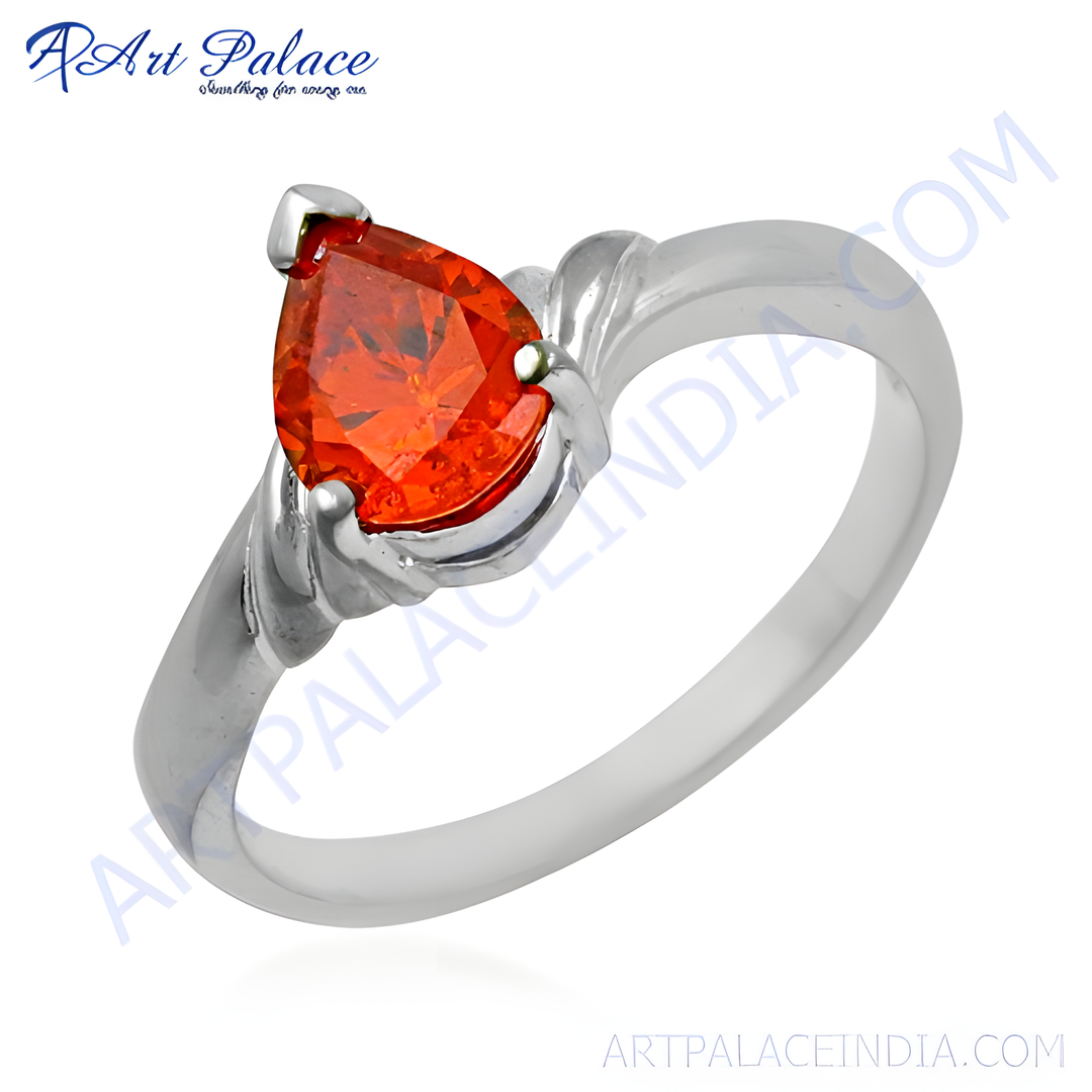 Sterling silver ring featuring a pear-cut orange gemstone, perfect for a gift or daily wear.