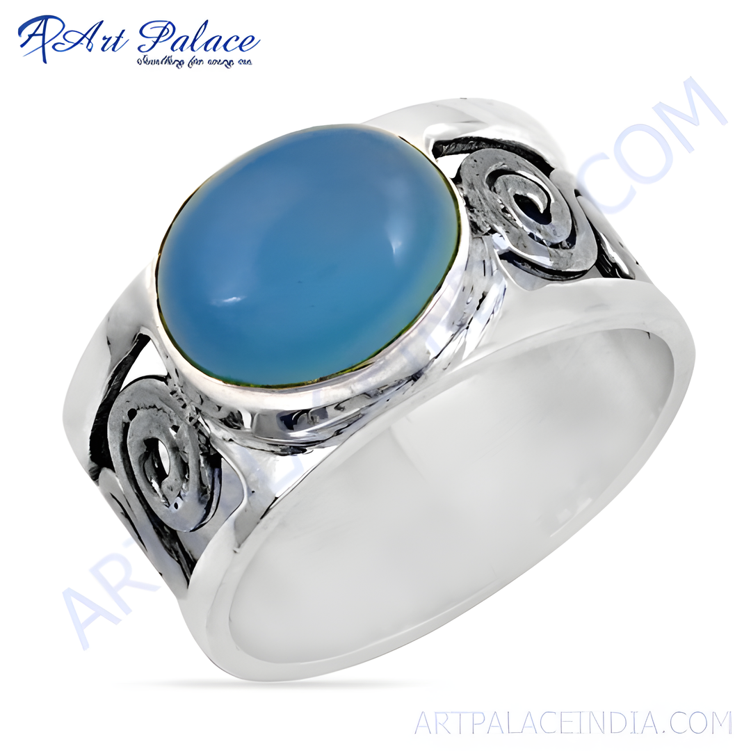 Sterling silver ring featuring a large oval blue chalcedony gemstone with decorative silver accents.