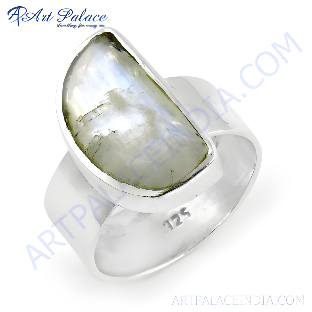Sterling silver statement ring with a large rainbow moonstone gemstone, showcasing a natural color