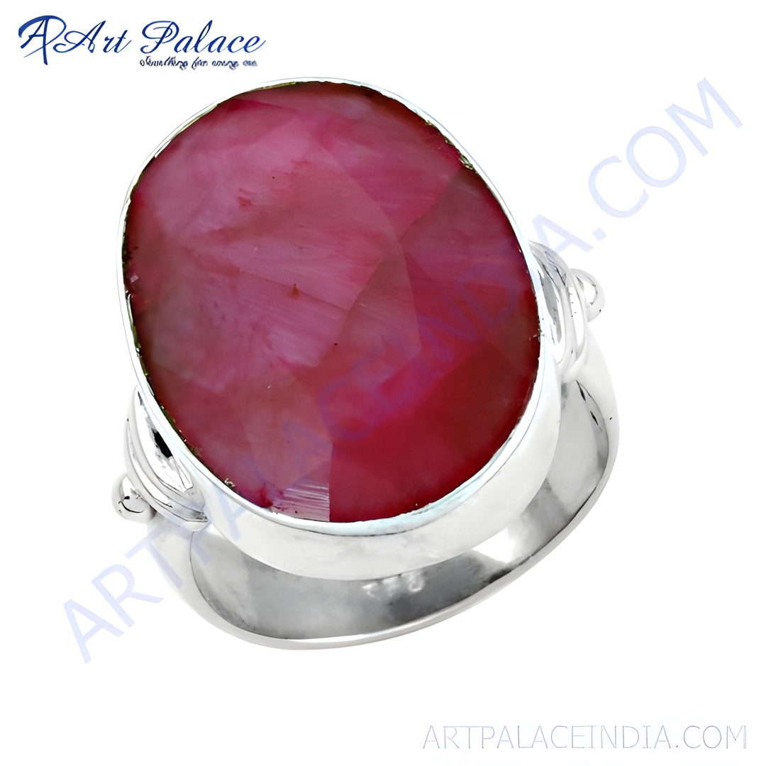 Sterling silver ring featuring a large oval-cut ruby gemstone, displaying shades of pink and red