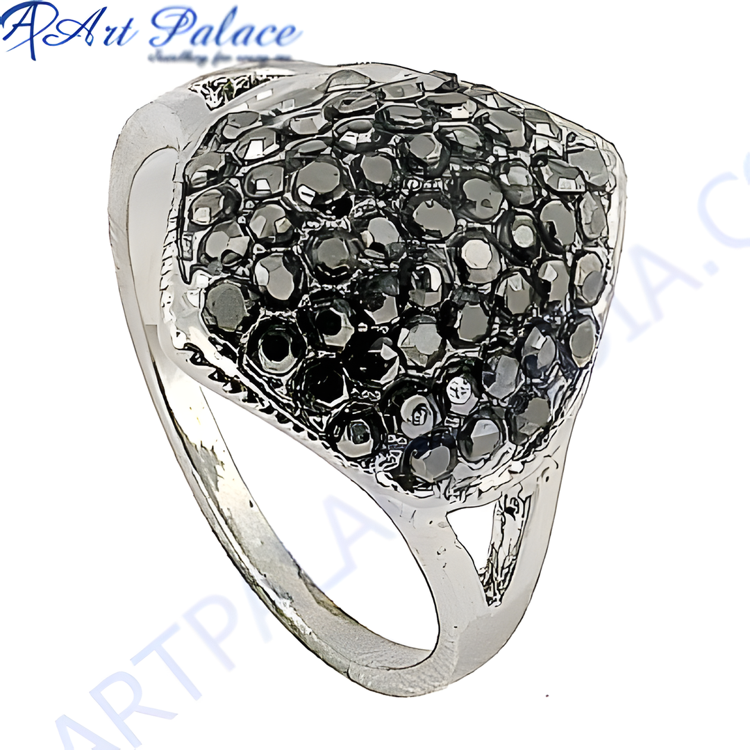 Silver cocktail ring with a cluster of black gemstones, a glamorous statement piece.