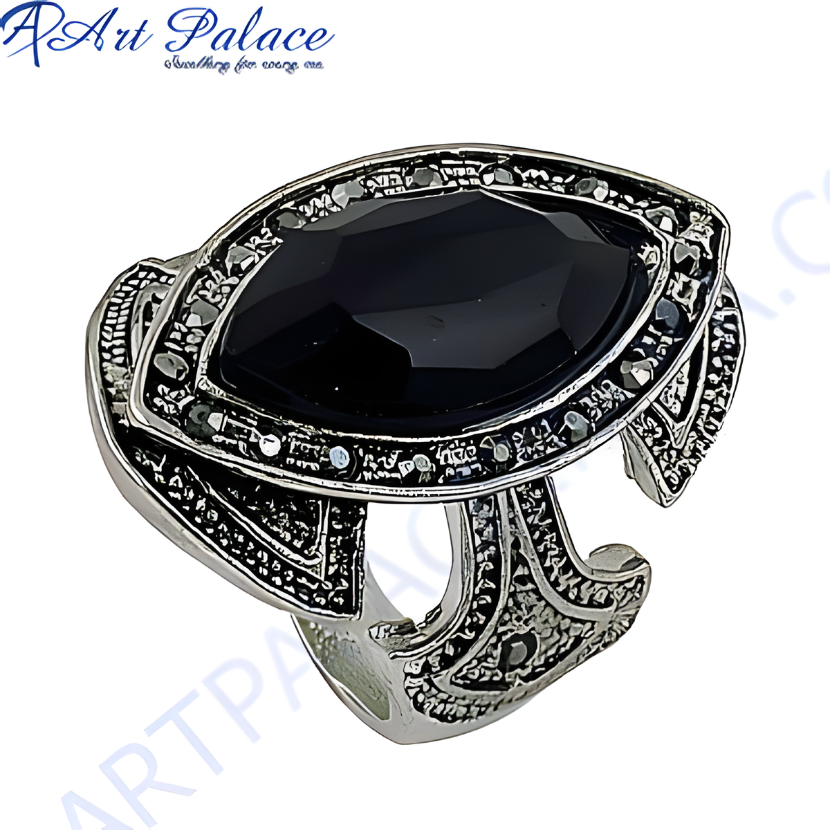 Silver statement ring with a large black onyx gemstone, showcasing intricate design and craftsmanship