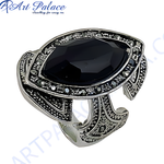 Load image into Gallery viewer, Silver statement ring with a large black onyx gemstone, showcasing intricate design and craftsmanship.
