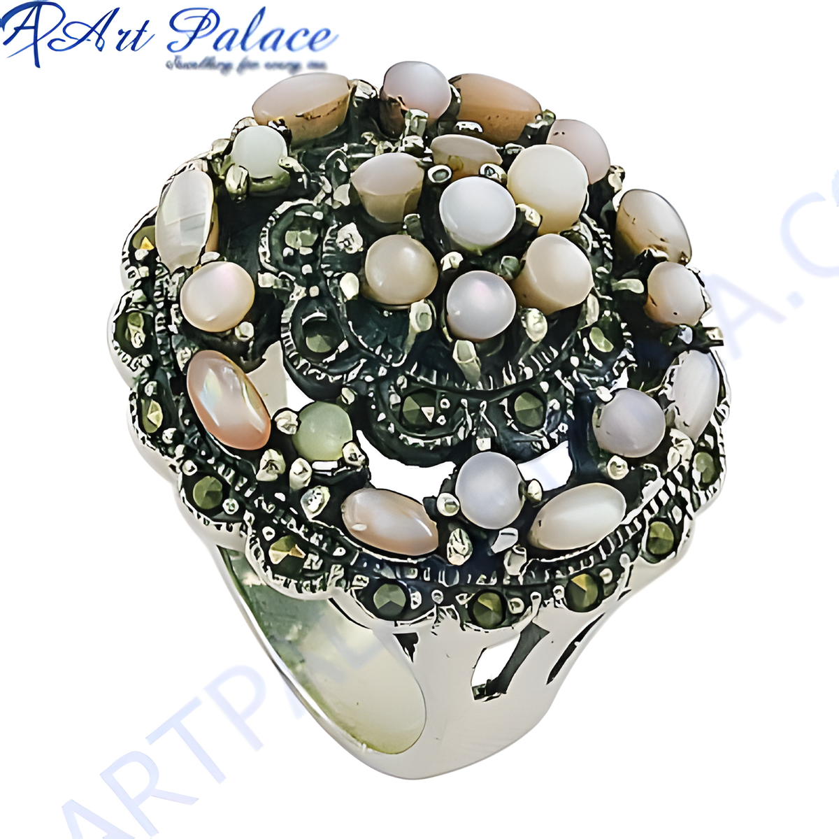 Sterling silver cocktail ring featuring mother of pearl gemstones and marcasite detailing on a white background