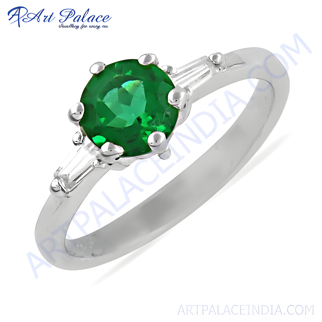 925 sterling silver emerald ring with a round green emerald center stone and baguette accents