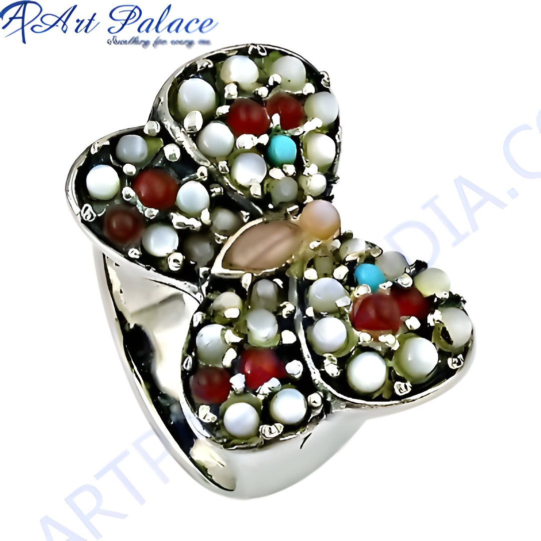 Sterling silver butterfly ring with colorful gemstones including white, red, and turquoise stones.