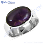 Load image into Gallery viewer, A sterling silver ring featuring a large oval-cut, deep purple amethyst gemstone.
