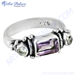 Load image into Gallery viewer, 925 sterling silver ring with a rectangular purple amethyst and two round accent gemstones.
