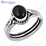 Load image into Gallery viewer, Sterling silver ring with a large oval-cut black onyx gemstone.
