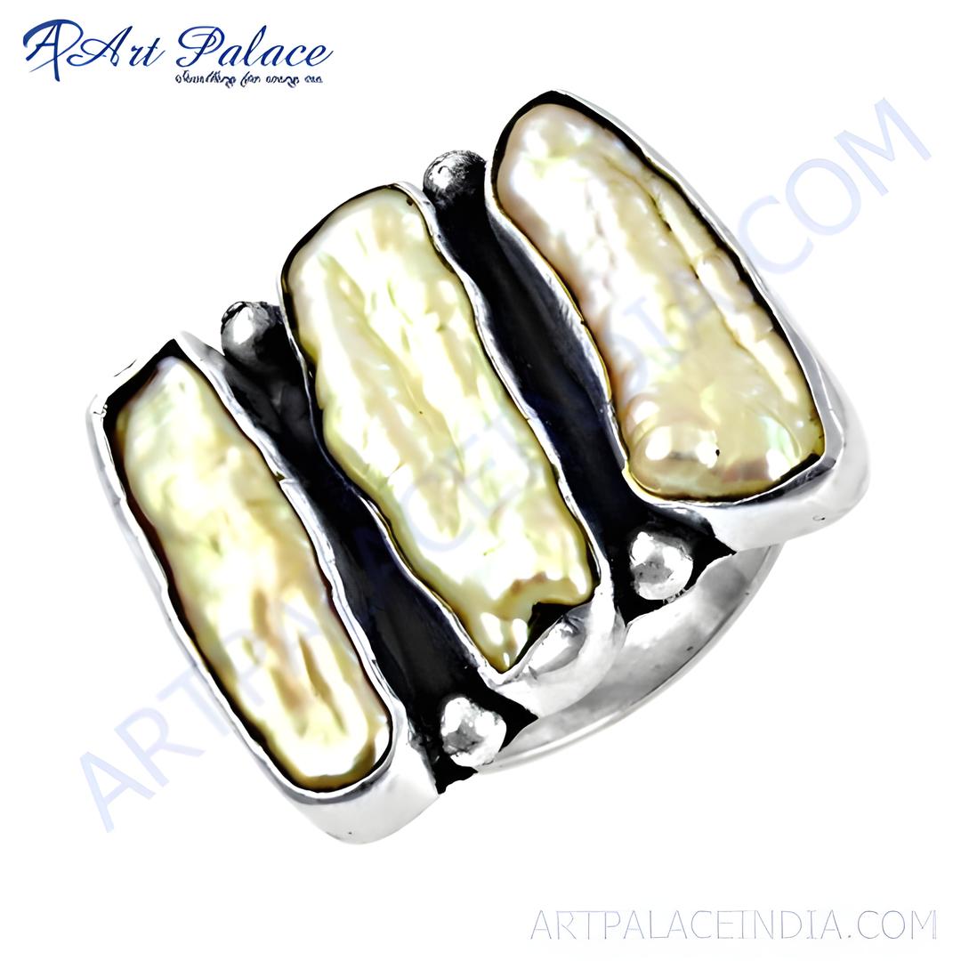 Sterling silver ring featuring three elongated pearl gemstones on a white background.
