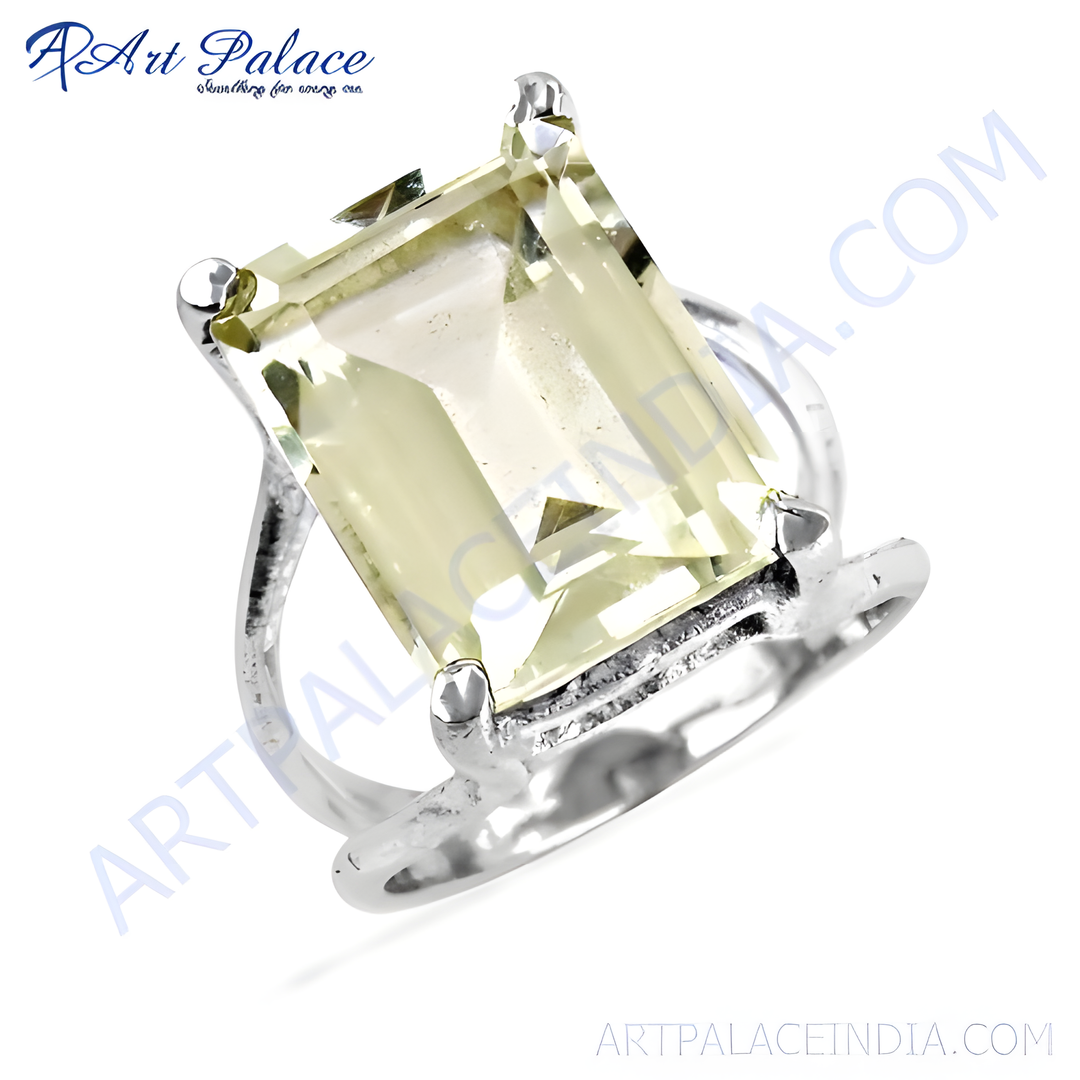 Sterling silver ring with a large emerald-cut yellow citrine gemstone, elegant design.