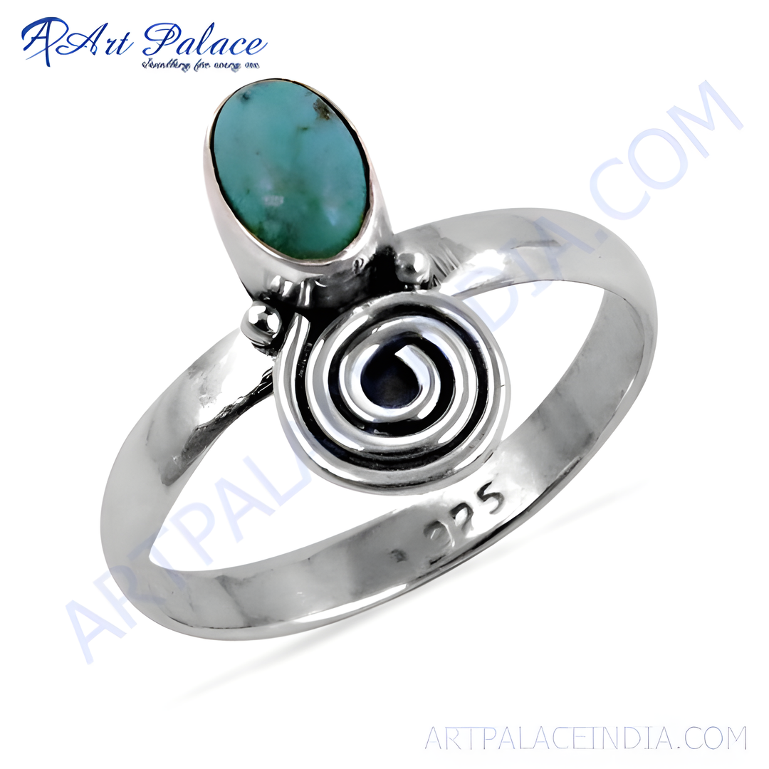 Sterling silver turquoise cocktail ring with a unique spiral design.
