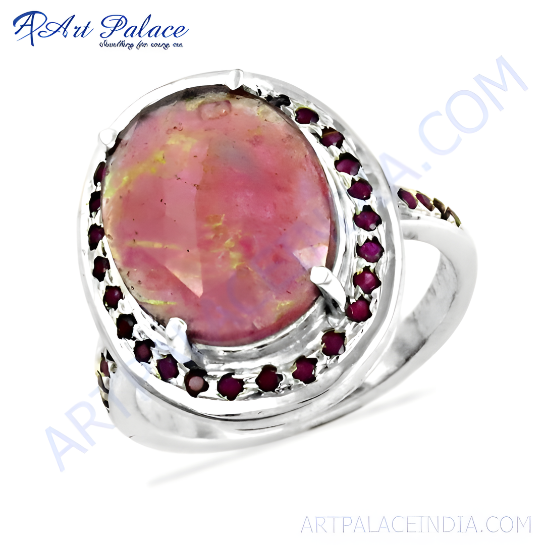 925 sterling silver ring with a pink opal center stone and surrounding rubies