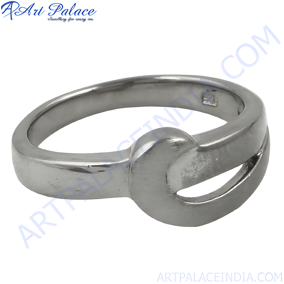 A polished silver crossover ring, a modern minimalist design for women's jewelry.