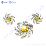 Load image into Gallery viewer, Silver jewelry set with yellow gemstone center in a spiral design, includes pendant and earrings
