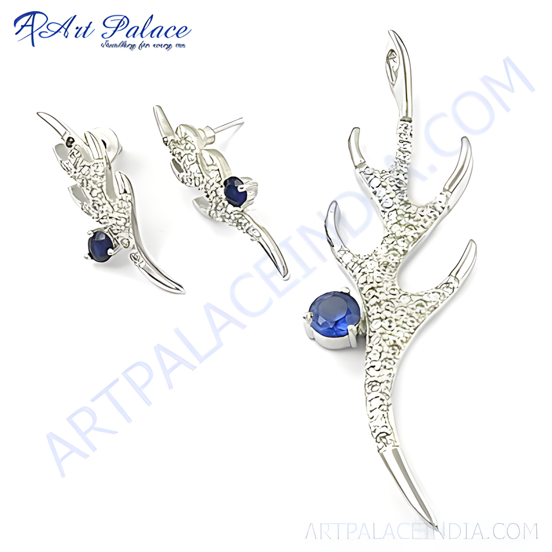 Sterling silver earrings and pendant set featuring blue sapphire gemstones in a unique claw design.