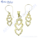 Load image into Gallery viewer, Gold pendant and earrings set with crystal heart design on white background

