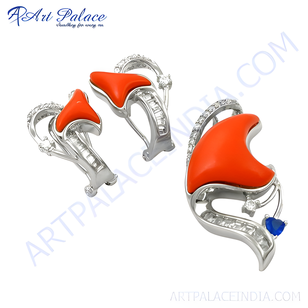 Silver earrings with bright red coral gemstones and sparkling accents, perfect for adding a pop of color and elegance to any outfit.