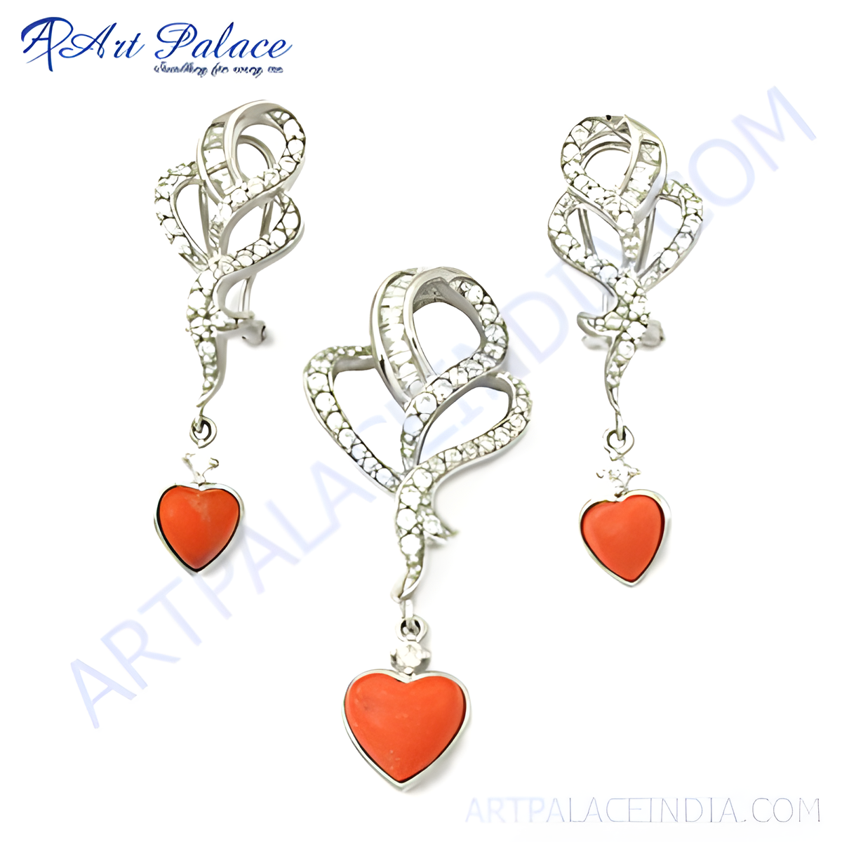 Silver pendant and earring set featuring heart shaped coral gemstones