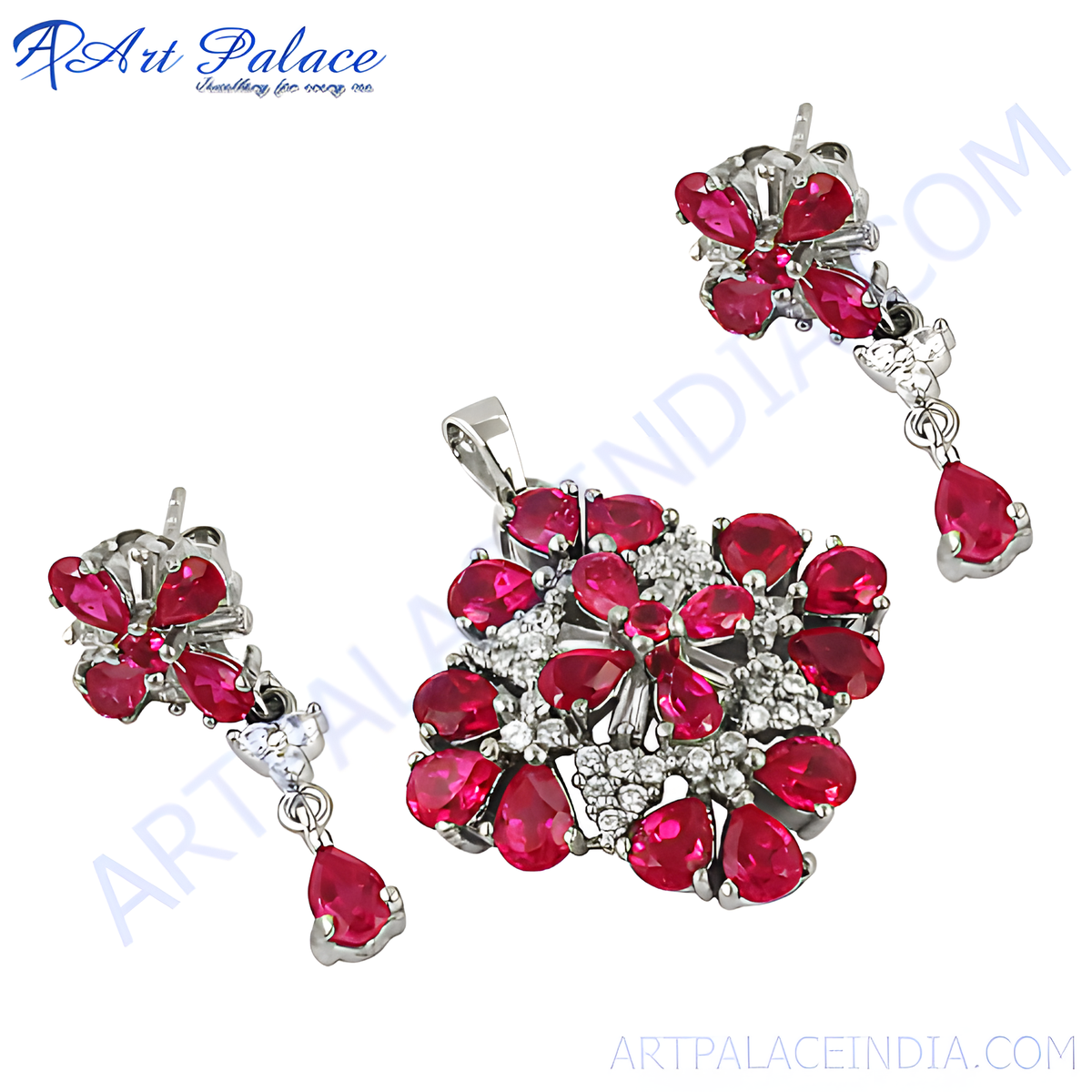 Silver pendant and matching ruby earrings set with red pear shaped gemstones, ideal for women