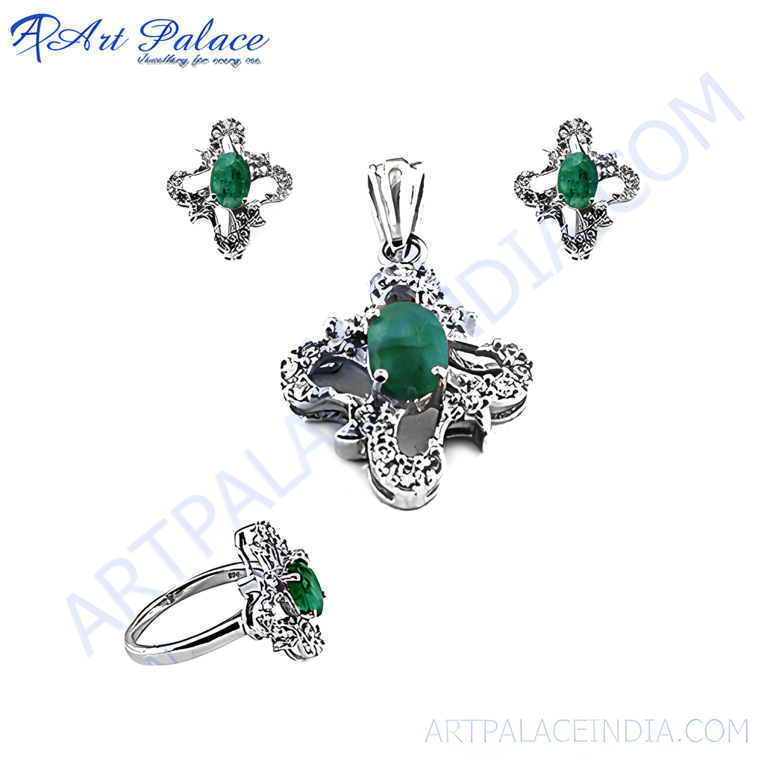 Sterling silver emerald jewelry set, including earrings, a pendant, and a ring, featuring vibrant green gemstones and an elegant floral design.