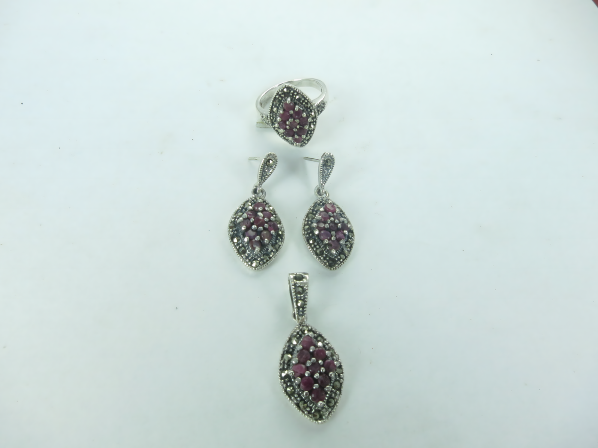 Sterling silver ring and earrings set with red rubies