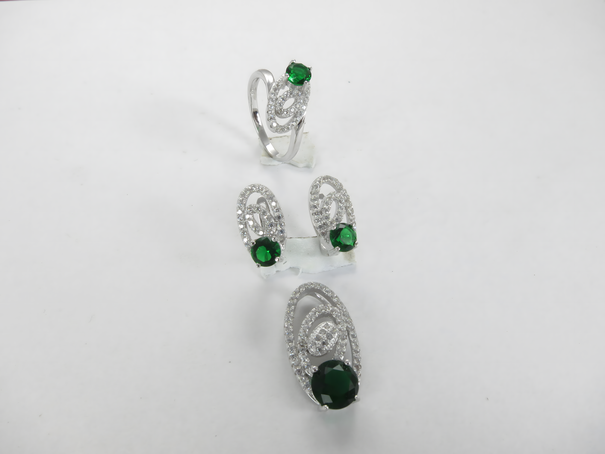 Sterling silver ring and earrings set featuring emerald green gemstones, a perfect jewelry gift