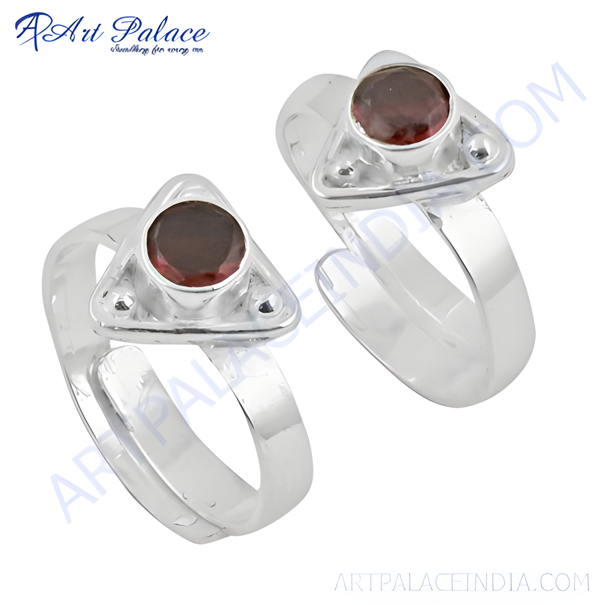 Sterling silver toe rings featuring a triangular design with a round, deep red garnet gemstone