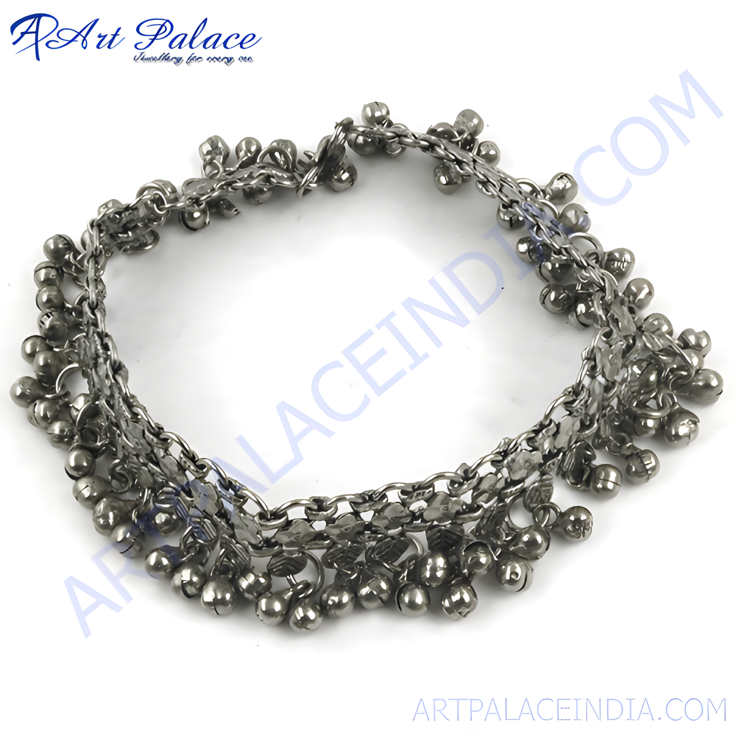 Silver anklet with dangling bells, perfect for adding a touch of bohemian style to your outfit.