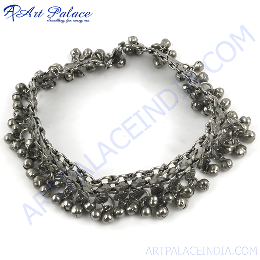 Silver anklet with dangling bells, perfect for adding a touch of bohemian style to your outfit.