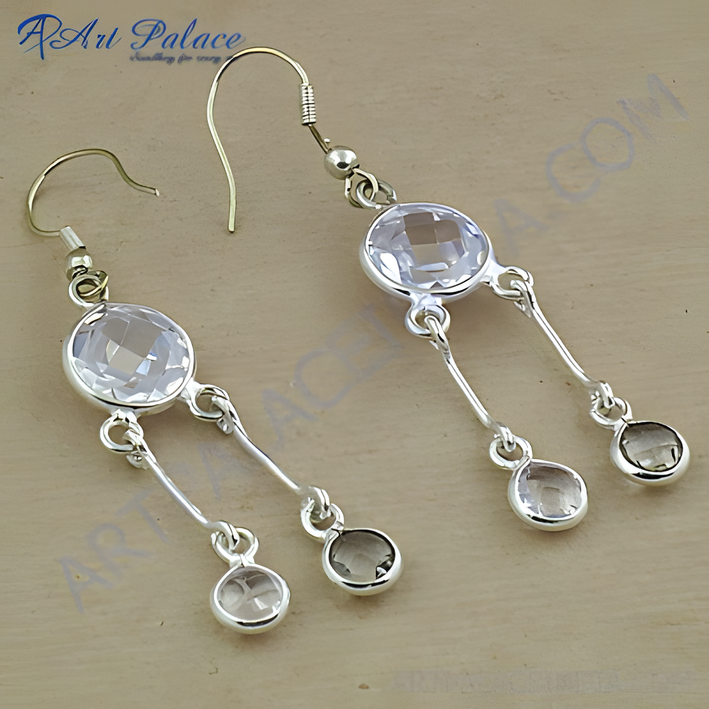 Sterling silver dangle earrings with clear and smoky quartz gemstones.