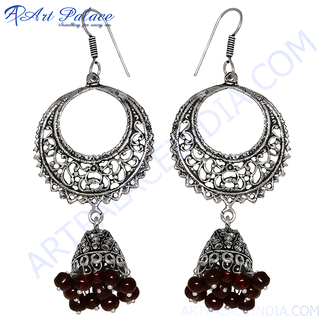 Silver filigree drop earrings with intricate detailing and red bead accents for women.