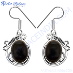 Load image into Gallery viewer, 925 Sterling silver dangle earrings with oval black onyx gemstones, perfect for any occasion.
