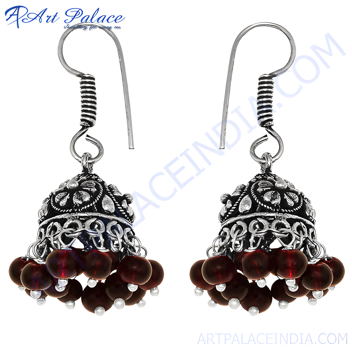 Silver jhumka earrings with ornate design and dangling red beads for women