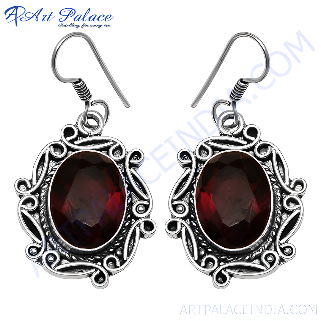 925 sterling silver drop earrings with oval red garnet gemstones.