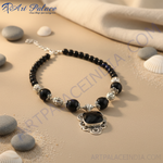 Load image into Gallery viewer, Black onyx bead necklace with a silver pendant, featuring a square-cut black stone.
