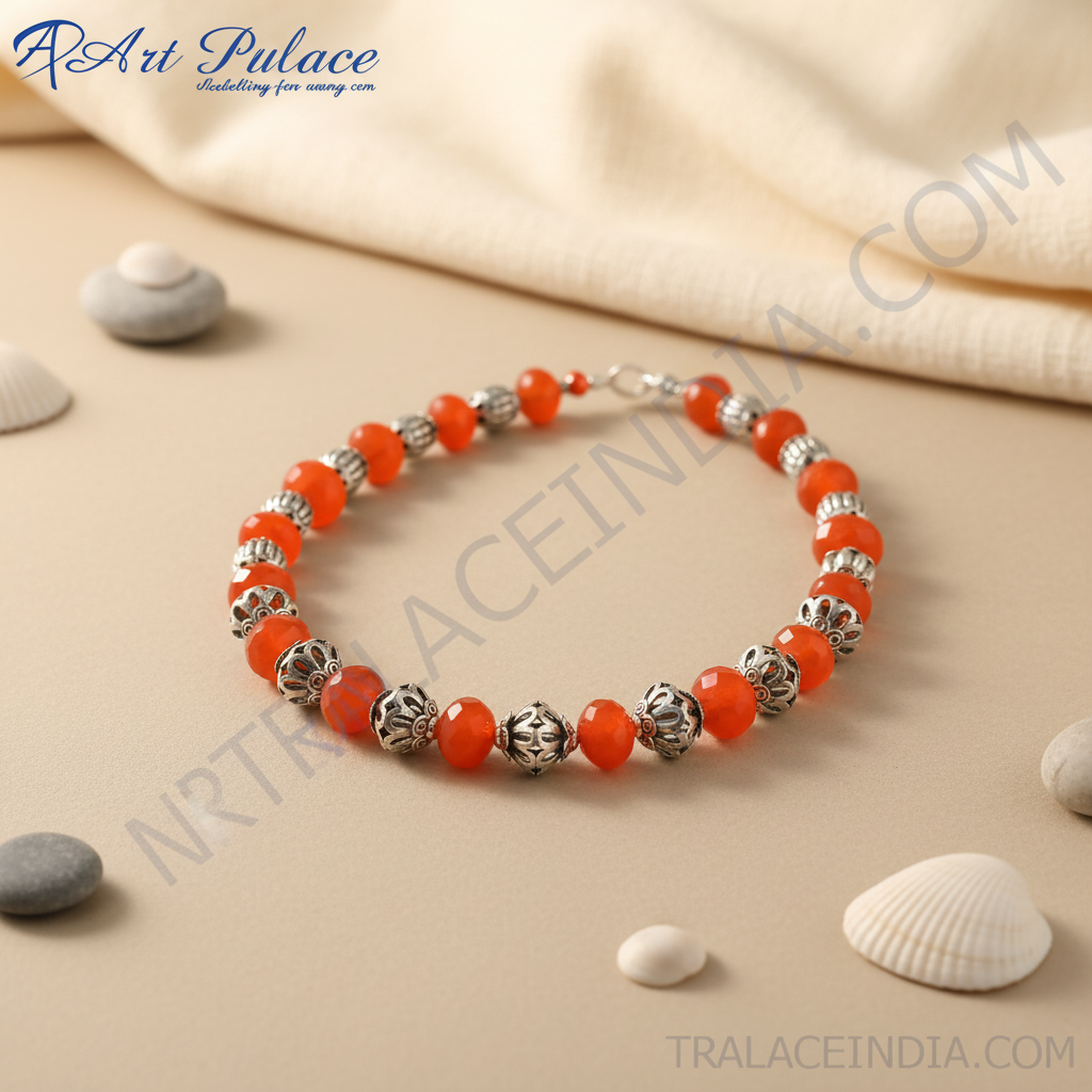 Red carnelian bead necklace with sterling silver accents on a black display.