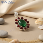 Load image into Gallery viewer, Sterling silver pendant with large oval green gemstone surrounded by red stones

