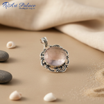 Load image into Gallery viewer, 925 sterling silver pendant with a round rose quartz gemstone in a floral design.
